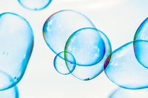 soap bubbles against the sky, reflection of the sun in the bubbles, color play, abstraction photo
