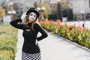 The girl with makeup of the mime. improvisation. mime shows different emotions photo