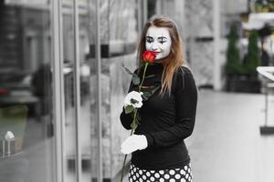 The girl with makeup of the mime. improvisation. mime shows different emotions photo