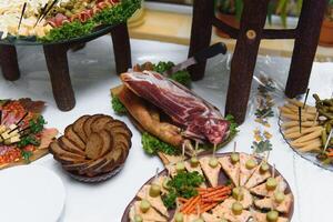 Delicious sweets on wedding candy buffet with desserts, cupcakes,tiramisu and cookies photo