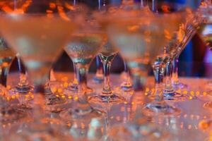 Champagne glasses standing in a tower at the party photo
