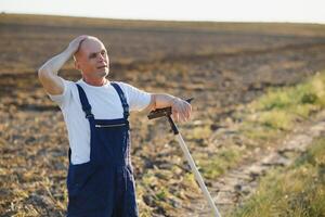 Senior farmer in a field. Agriculture concept photo