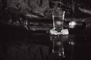 Vodka. Shots, glasses with vodka with ice .Dark background. Copy space .Selective focus. photo