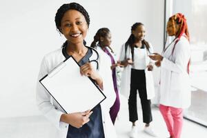 Portrait Of Medical Team Standing Outside Hospital. photo