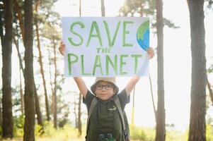 demonstration against global warming and pollution. Child boy making protest about climate change, plastic problems, global warming, pollution. Save the planet poster. Climate Strike. Eco Activism. photo