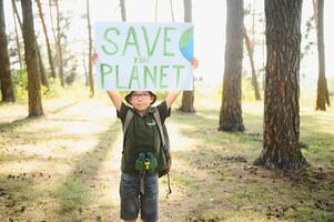 demonstration against global warming and pollution. Child boy making protest about climate change, plastic problems, global warming, pollution. Save the planet poster. Climate Strike. Eco Activism. photo