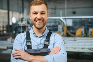 Factory worker. Man working on the production line. photo