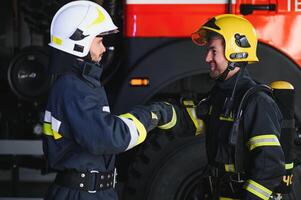 firemen leaving the station equipped and with the tools for the extinction of the fire photo
