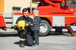 Protect people from dangerous with brave heart.Hero in fireman with uniform safe children from burn smoke photo