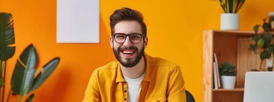 Smiling Young Professional Working Comfortably at Colorful Desk photo