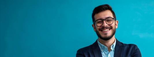 Smiling Young Tech Executive Posing with Confidence on Blue Background photo