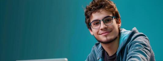 Portrait of a Confident Young Professional Computer Programmer Working on a Vibrant Colored Background photo