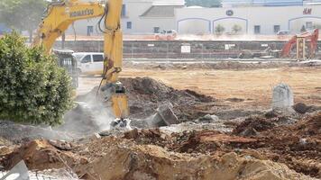 Malaga, Spain, 2017 - Hammer excavator hitting debris in a demolition of a building video