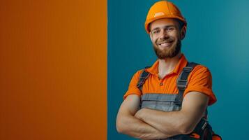 Confident Construction Worker in Bright Orange Uniform Smiling on Colorful Studio Background photo
