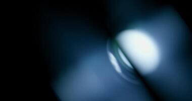 White lens flare overlay on black background. Spherical Optical Prism Light abstract background 4K video