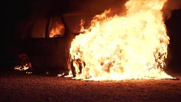 Burning car close to a house in the city of slow motion. Theme of criminal revenge and set fire video