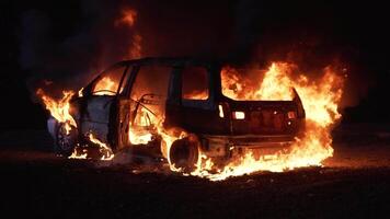 Car burning in flames after a crash at night. video