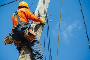 Electrician Working on a Power Pole photo