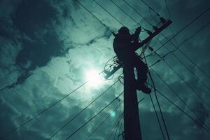 Electrician Working on a Power Pole photo