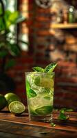 Refreshing Mojito Cocktail With Lime and Mint on Wooden Table photo