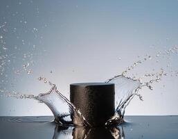 empty black podium mockup with water splash on a grey gradient background for product display photo