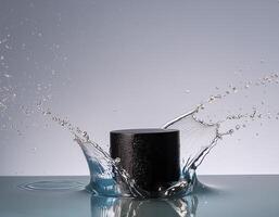 empty black podium mockup with water splash on a grey gradient background for product display photo