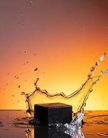 empty black podium mockup with water splash on a orange gradient background for product display photo