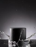 empty black podium mockup with water splash on a grey gradient background for product display photo