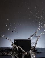 empty black podium mockup with water splash on a grey gradient background for product display photo
