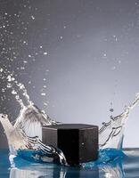 empty black podium mockup with water splash on a grey gradient background for product display photo