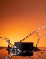 empty black podium mockup with water splash on a orange gradient background for product display photo