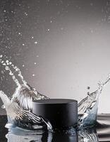 empty black podium mockup with water splash on a grey gradient background for product display photo