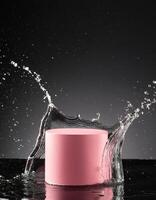 empty pink podium mockup with water splash on a black gradient background for product display photo