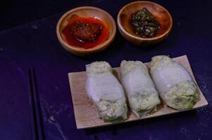 Sawi gulung tahu or rolled Chinese cabbage with tofu. Served with red chilli sauce and green chilli sauce. photo