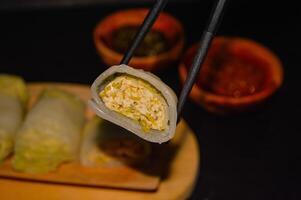 Sawi gulung tahu or rolled Chinese cabbage with tofu. Served with red chilli sauce and green chilli sauce. photo