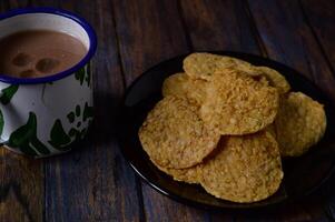 Tempeh chips are a food made from tempeh which is thinly sliced and then fried using seasoned flour. Usually the taste is salty with a savory onion aroma. photo