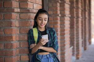 Academy Woman Using Her Cellphone On the College Balcony photo