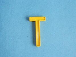 Macro photo or closeup photo of the alphabet from children's toys on a blue background. Use on preschool also