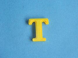 Macro photo or closeup photo of the alphabet from children's toys on a blue background. Use on preschool also