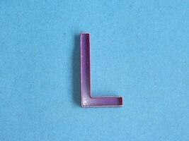 Macro photo or closeup photo of the alphabet from children's toys on a blue background. Use on preschool also