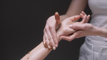 Spa salon.Action. A thin, beautiful hand of a girl who is smeared with scented oils for health. video