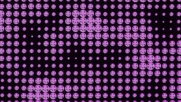 Dots moving in waves on black background. Design. Points of different sizes change in wave flow. Colored dots move in waves in retro or disco style video