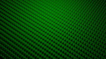 Abstract flat colorful green surface covered by rows of convex same size figures, seamless loop. Design. Flowing small particles. video
