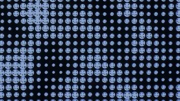 Concert tiny round shaped elements on a black background. Design. Panel with the LED bulbs with glowing lights. video