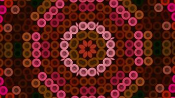 Kaleidoscope seamless loop pattern with multicolored motion graphics background. Media. Magic mandala with small circles. video
