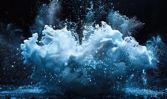 Burst of water explosion, aqua blue splashes and drops on black background photo