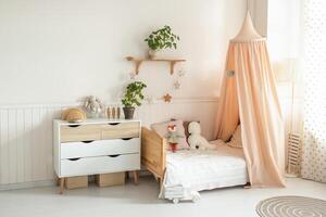 a cozy and bright children's room with a four-poster bed, a chest of drawers, a floor lamp and cute soft toys. light background photo