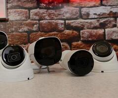 Metal outdoor CCTV cameras for visual surveillance systems on a shelf at security store photo