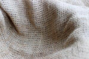 Handicraft Open Weave Burlap Nest Closeup View. Rough Crumpled Burlap Background photo
