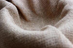 Selective and partial focus burlap fabric in nest shape background photo